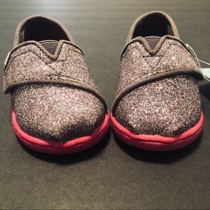 TOMS kid’s glitter slip-on shoes